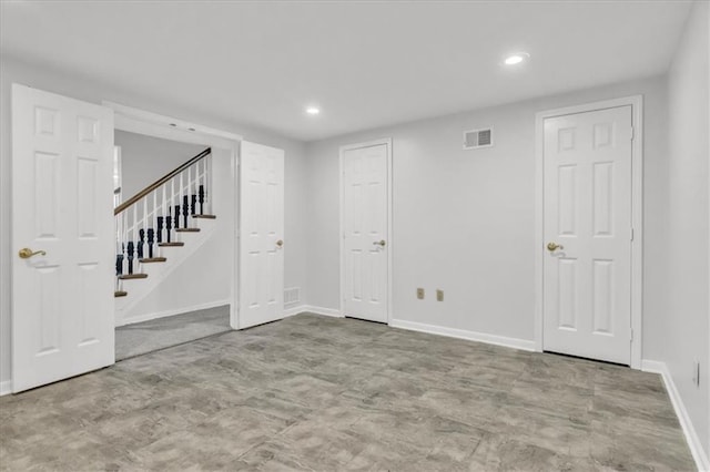 1600 NE 97th St, Kansas City, MO 64155 - below grade area featuring stairway, recessed lighting, and baseboards