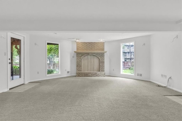 1600 NE 97th St, Kansas City, MO 64155 - unfurnished living room with carpet flooring, baseboards, and a brick fireplace