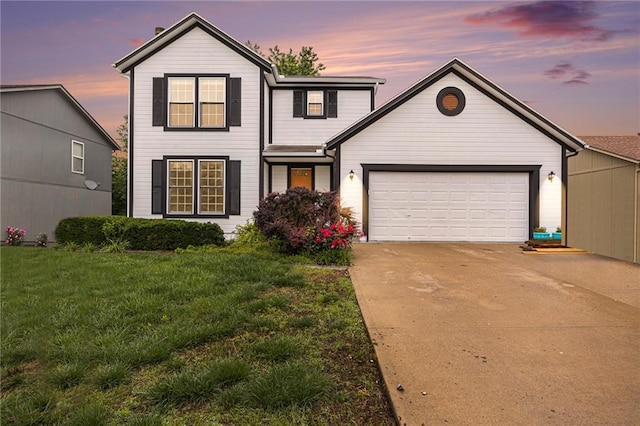 417 N Locust St, Gardner, KS 66030 - traditional home featuring concrete driveway, an attached garage, and a front yard