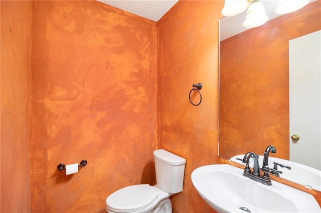 417 N Locust St, Gardner, KS 66030 - bathroom featuring toilet and a textured ceiling