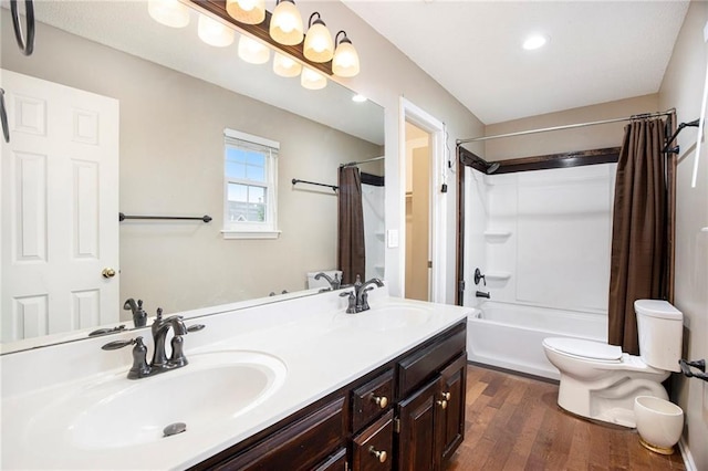 417 N Locust St, Gardner, KS 66030 - full bath featuring shower / bath combination with curtain, double vanity, and wood finished floors