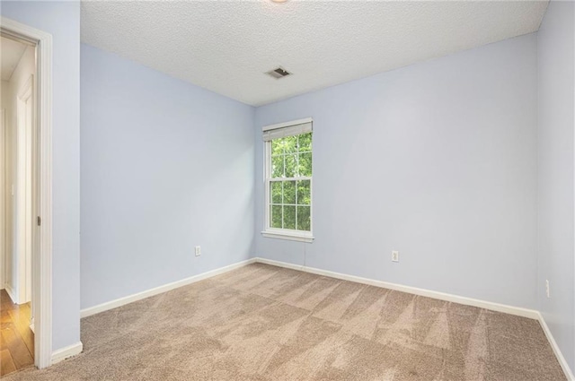 417 N Locust St, Gardner, KS 66030 - carpeted spare room featuring a textured ceiling