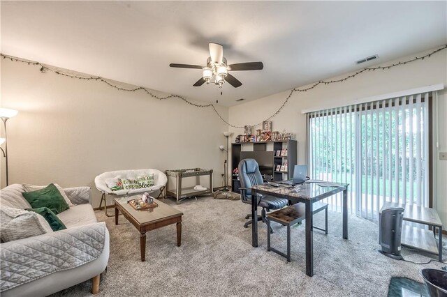 office featuring ceiling fan and light carpet