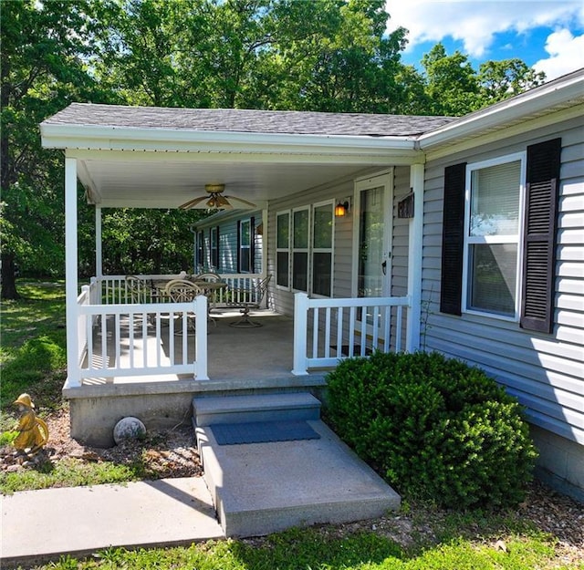 20435 Rb Hwy, Flemington, MO 65650 - view of exterior entry with covered porch, a ceiling fan, and roof with shingles