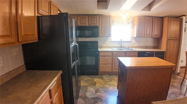 20435 Rb Hwy, Flemington, MO 65650 - kitchen featuring black appliances, a sink, a kitchen island, and brown cabinetry