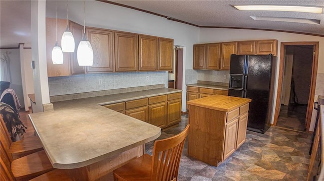 20435 Rb Hwy, Flemington, MO 65650 - kitchen with black refrigerator with ice dispenser, lofted ceiling, a peninsula, decorative backsplash, and brown cabinets