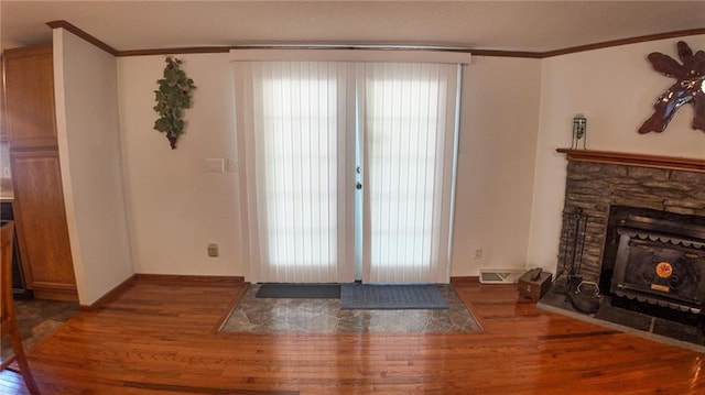 20435 Rb Hwy, Flemington, MO 65650 - doorway featuring wood finished floors, crown molding, and a stone fireplace