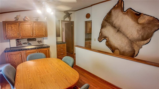 20435 Rb Hwy, Flemington, MO 65650 - dining area with wood finished floors, ornamental molding, and a ceiling fan
