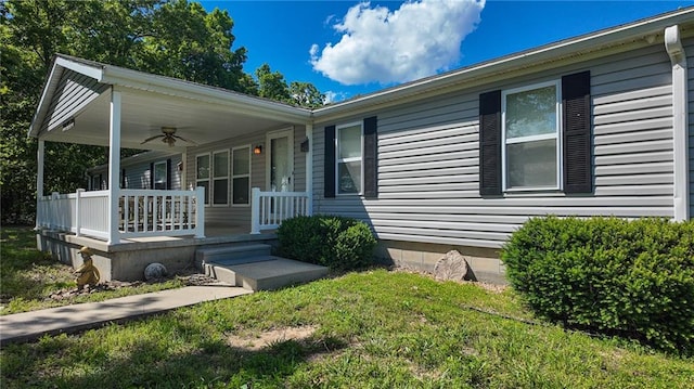 20435 Rb Hwy, Flemington, MO 65650 - view of front of property featuring a porch, ceiling fan, and a front lawn