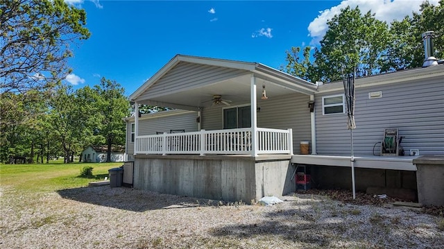 20435 Rb Hwy, Flemington, MO 65650 - back of property featuring a ceiling fan, a yard, and covered porch
