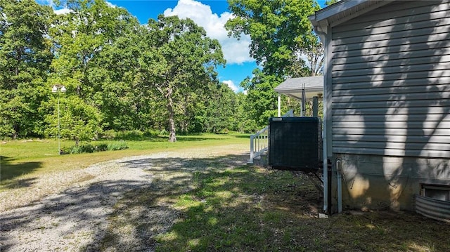 20435 Rb Hwy, Flemington, MO 65650 - view of grassy yard featuring central air condition unit