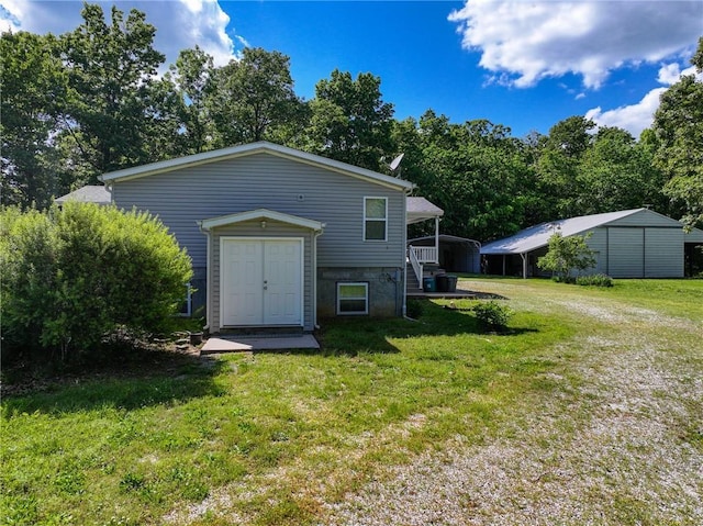 20435 Rb Hwy, Flemington, MO 65650 - back of property featuring a carport, a lawn, and driveway