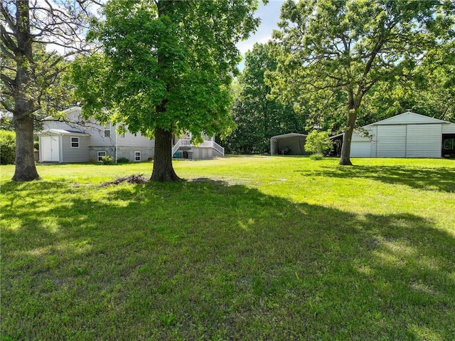 20435 Rb Hwy, Flemington, MO 65650 - view of green lawn with a detached carport