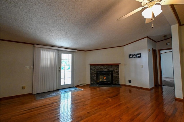 20435 Rb Hwy, Flemington, MO 65650 - unfurnished living room with hardwood / wood-style flooring, a textured ceiling, ornamental molding, ceiling fan, and baseboards