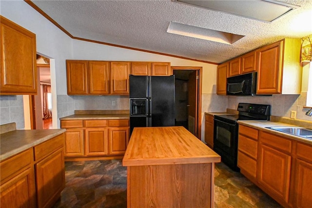 20435 Rb Hwy, Flemington, MO 65650 - kitchen with black appliances, a sink, butcher block counters, dark stone finish flooring, and ornamental molding