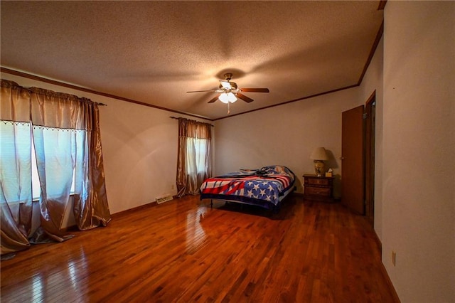 20435 Rb Hwy, Flemington, MO 65650 - bedroom with crown molding, wood finished floors, a textured ceiling, multiple windows, and a ceiling fan