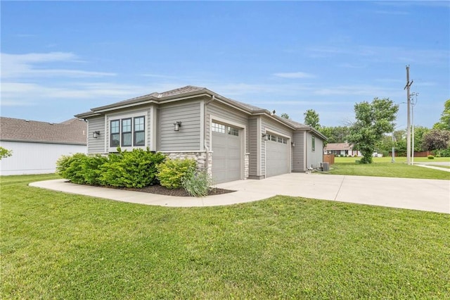 301 Sunrise Dr, Louisburg, KS 66053 - view of property exterior with a garage, concrete driveway, a lawn, and stone siding