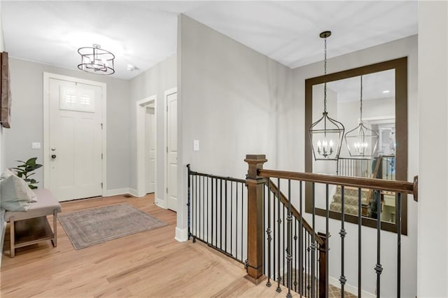 301 Sunrise Dr, Louisburg, KS 66053 - foyer entrance with a chandelier, light wood-type flooring, and baseboards