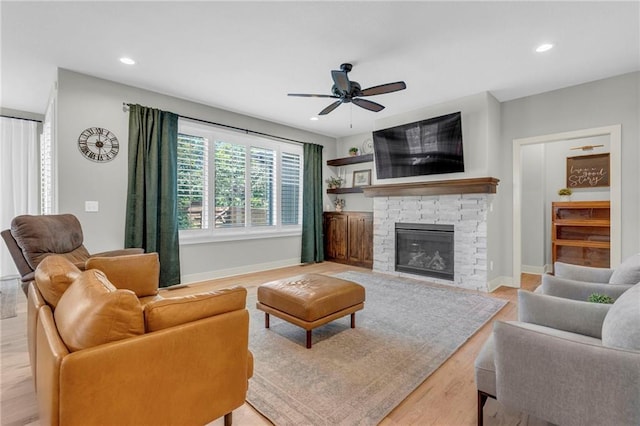 301 Sunrise Dr, Louisburg, KS 66053 - living room with ceiling fan, baseboards, light wood finished floors, recessed lighting, and a fireplace