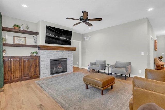 301 Sunrise Dr, Louisburg, KS 66053 - living area with a ceiling fan, light wood-type flooring, a fireplace, recessed lighting, and baseboards