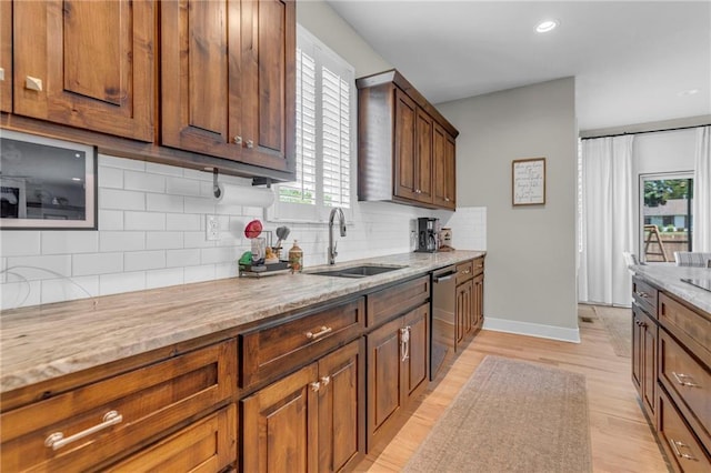 301 Sunrise Dr, Louisburg, KS 66053 - kitchen featuring a sink, dishwasher, plenty of natural light, decorative backsplash, and recessed lighting