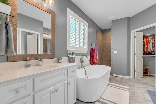 301 Sunrise Dr, Louisburg, KS 66053 - full bathroom featuring a freestanding tub, vanity, and a walk in closet