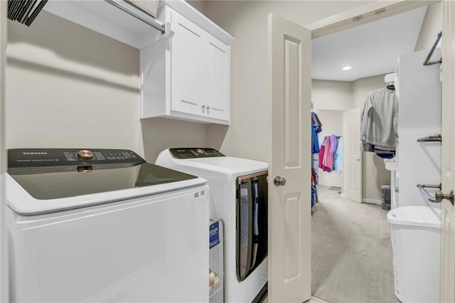 301 Sunrise Dr, Louisburg, KS 66053 - washroom featuring washing machine and clothes dryer, cabinet space, light colored carpet, recessed lighting, and baseboards