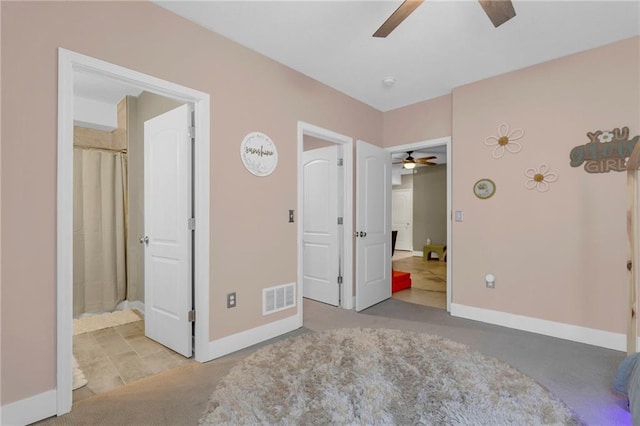 301 Sunrise Dr, Louisburg, KS 66053 - unfurnished bedroom featuring baseboards, ceiling fan, and ensuite bath