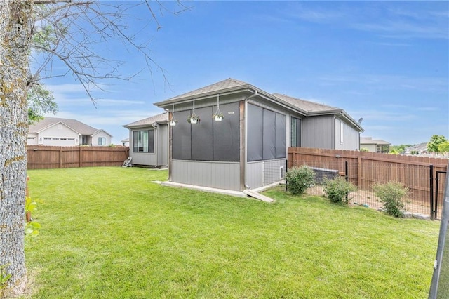 301 Sunrise Dr, Louisburg, KS 66053 - back of house featuring a sunroom