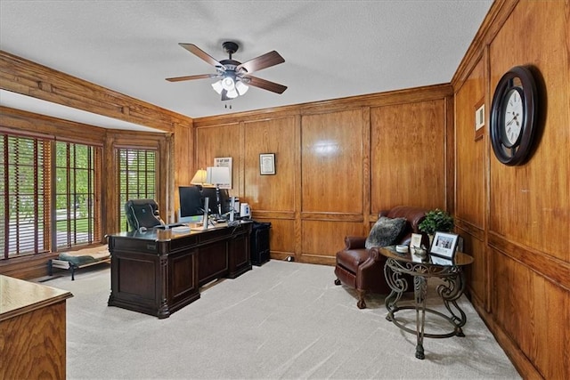 12613 Sherwood St, Leawood, KS 66209 - office area featuring light carpet, ceiling fan, wooden walls, and a textured ceiling