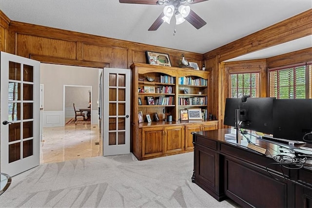 12613 Sherwood St, Leawood, KS 66209 - office featuring french doors, a ceiling fan, wood walls, light colored carpet, and a decorative wall