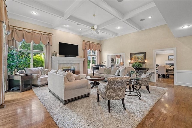 12613 Sherwood St, Leawood, KS 66209 - living area featuring a fireplace, wood finished floors, beam ceiling, coffered ceiling, and a ceiling fan