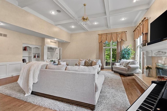 12613 Sherwood St, Leawood, KS 66209 - living room featuring coffered ceiling, wood finished floors, ceiling fan, beam ceiling, and a decorative wall