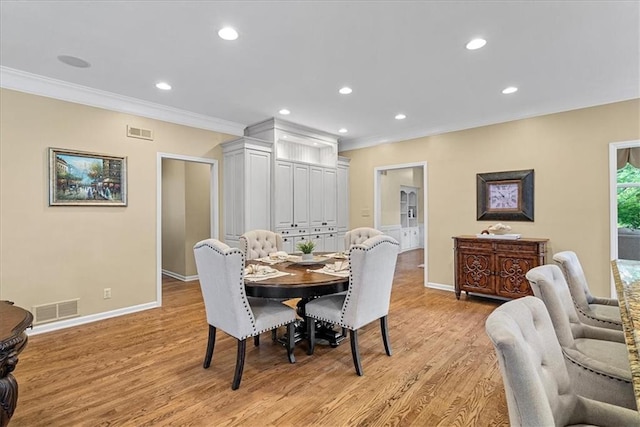 12613 Sherwood St, Leawood, KS 66209 - dining area featuring crown molding, baseboards, light wood finished floors, and recessed lighting