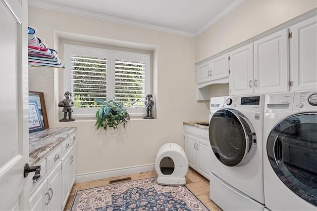 12613 Sherwood St, Leawood, KS 66209 - laundry area featuring washing machine and dryer, cabinet space, ornamental molding, and baseboards