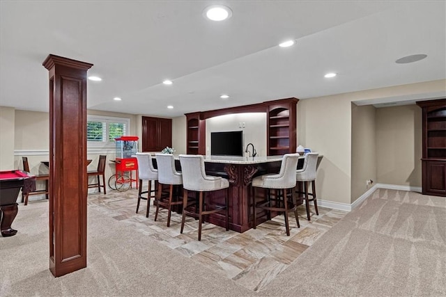 12613 Sherwood St, Leawood, KS 66209 - indoor wet bar with light carpet, recessed lighting, baseboards, and decorative columns