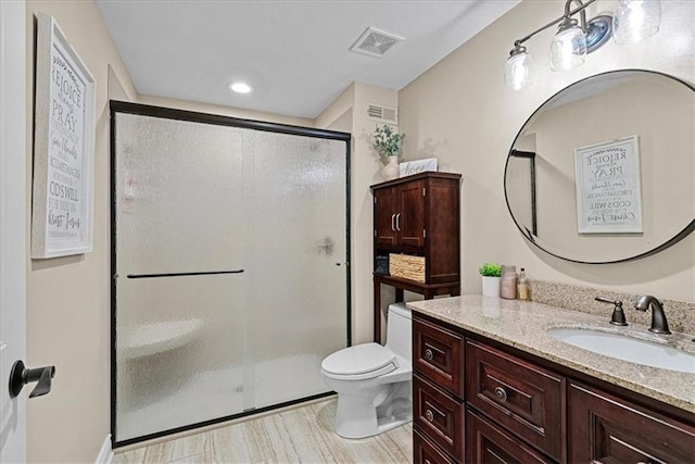 12613 Sherwood St, Leawood, KS 66209 - bathroom featuring vanity, toilet, a shower stall, and recessed lighting