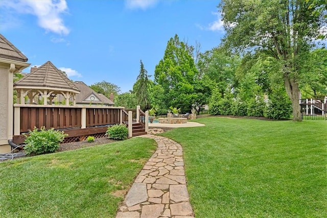 12613 Sherwood St, Leawood, KS 66209 - view of grassy yard with a gazebo and a wooden deck