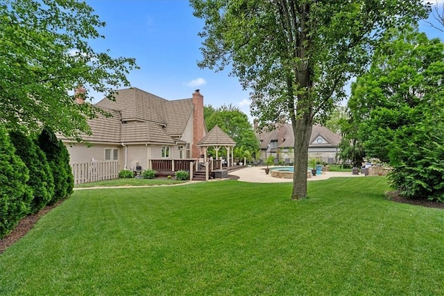 12613 Sherwood St, Leawood, KS 66209 - view of yard featuring a gazebo, a wooden deck, and a patio