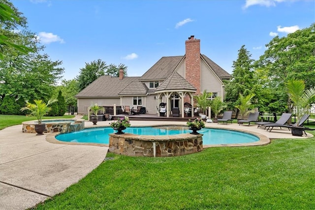 12613 Sherwood St, Leawood, KS 66209 - view of swimming pool with a pool with connected hot tub, a yard, and a patio