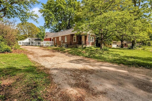 315 S Crane St S, Independence, MO 64050 - ranch-style house featuring brick siding and dirt driveway