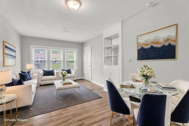 315 S Crane St S, Independence, MO 64050 - living area with wood finished floors, baseboards, and built in shelves