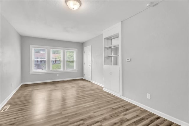 315 S Crane St S, Independence, MO 64050 - empty room with wood finished floors and baseboards