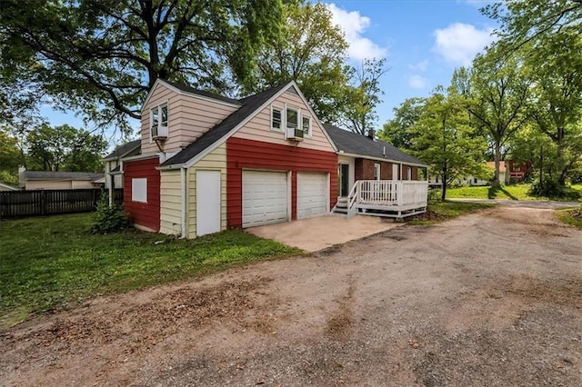 315 S Crane St S, Independence, MO 64050 - garage featuring fence and dirt driveway