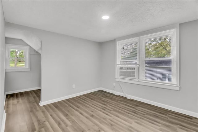 315 S Crane St S, Independence, MO 64050 - empty room with baseboards, wood finished floors, recessed lighting, and cooling unit