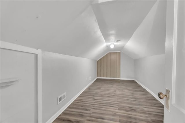 315 S Crane St S, Independence, MO 64050 - bonus room with baseboards, lofted ceiling, and wood finished floors