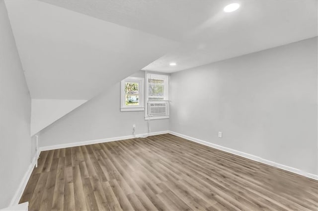 315 S Crane St S, Independence, MO 64050 - bonus room featuring wood finished floors, cooling unit, baseboards, and recessed lighting