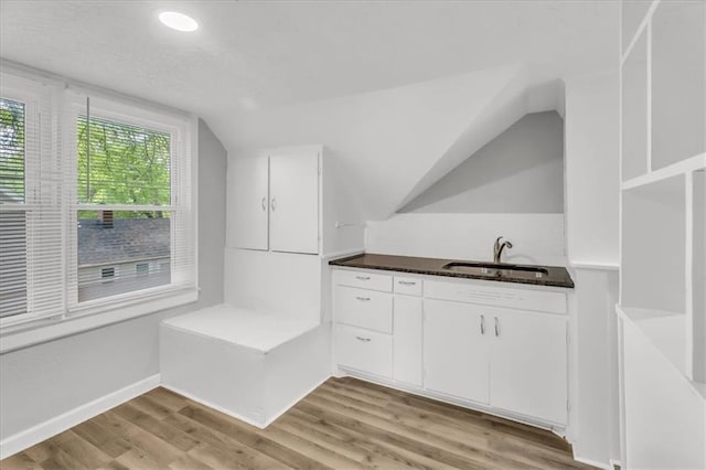 315 S Crane St S, Independence, MO 64050 - bar area with a sink, vaulted ceiling, light wood-style flooring, baseboards, and recessed lighting