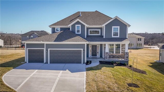 view of front of property featuring covered porch, concrete driveway, an attached garage, and roof with shingles