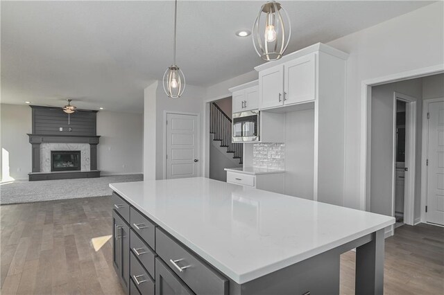 kitchen featuring a ceiling fan, white cabinets, dark wood-style floors, light countertops, and recessed lighting
